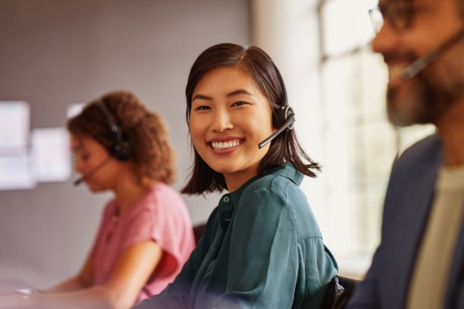 Adviser on a call smiling