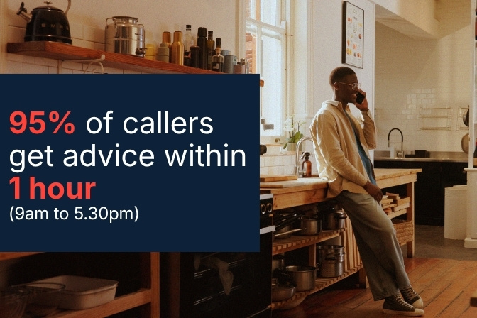 Man on phone in kitchen